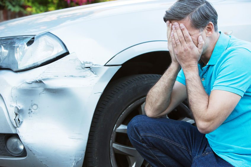 Free Stock Photo of Mechanic repairing car damage at auto shop